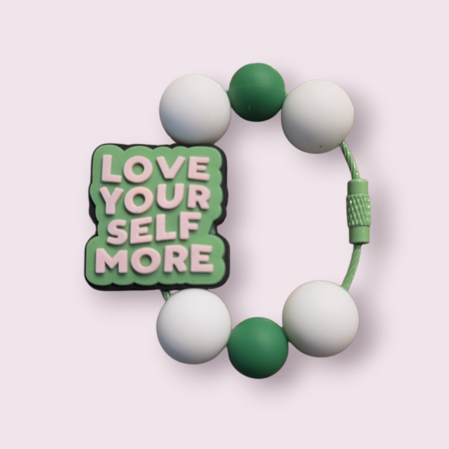 Green and white beaded bracelet with 'Love Your Self More' charm, motivational accessory