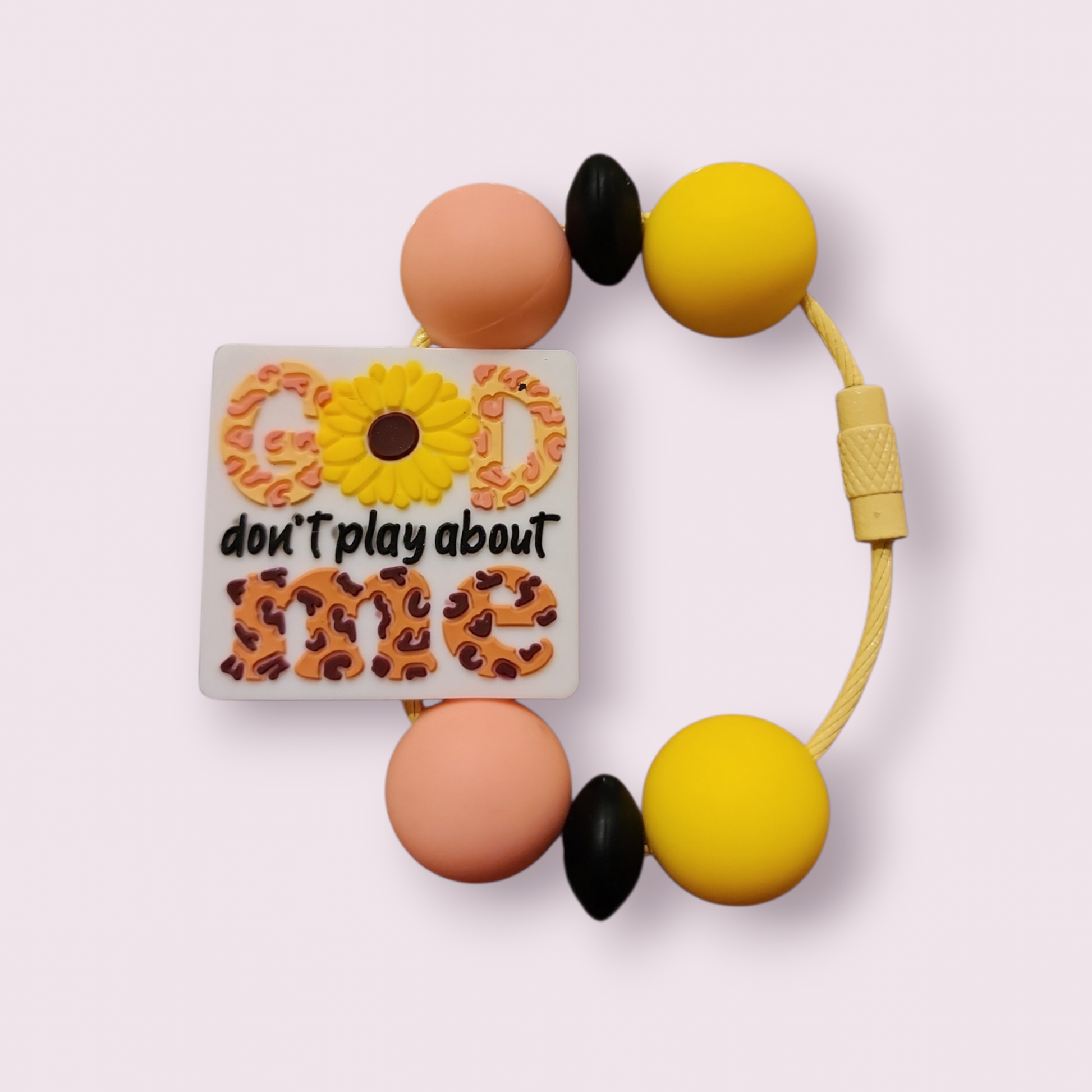 Colorful beaded bracelet with 'God don't play about me' charm, sunflower, and leopard print design