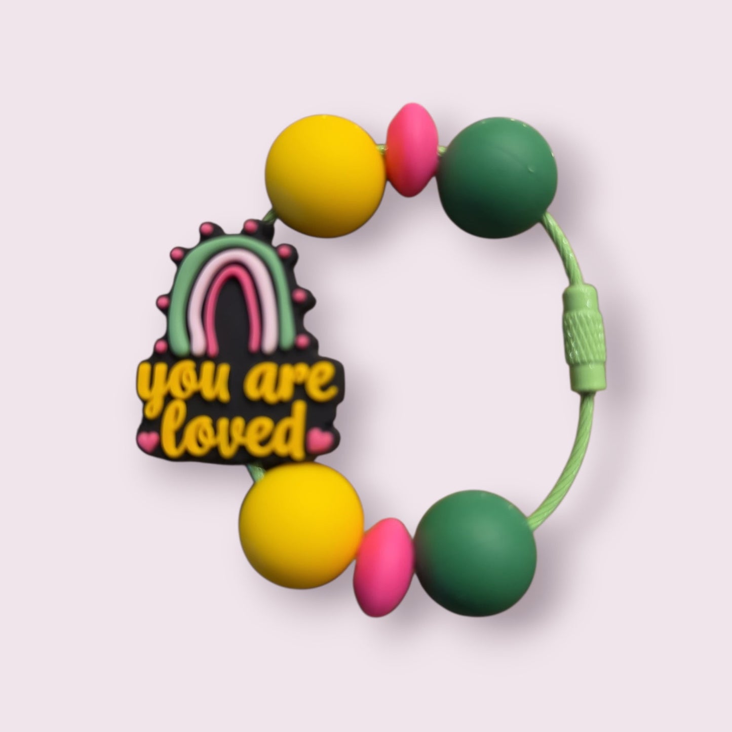 Colorful silicone teether with rainbow 'you are loved' charm, yellow, pink, green beads