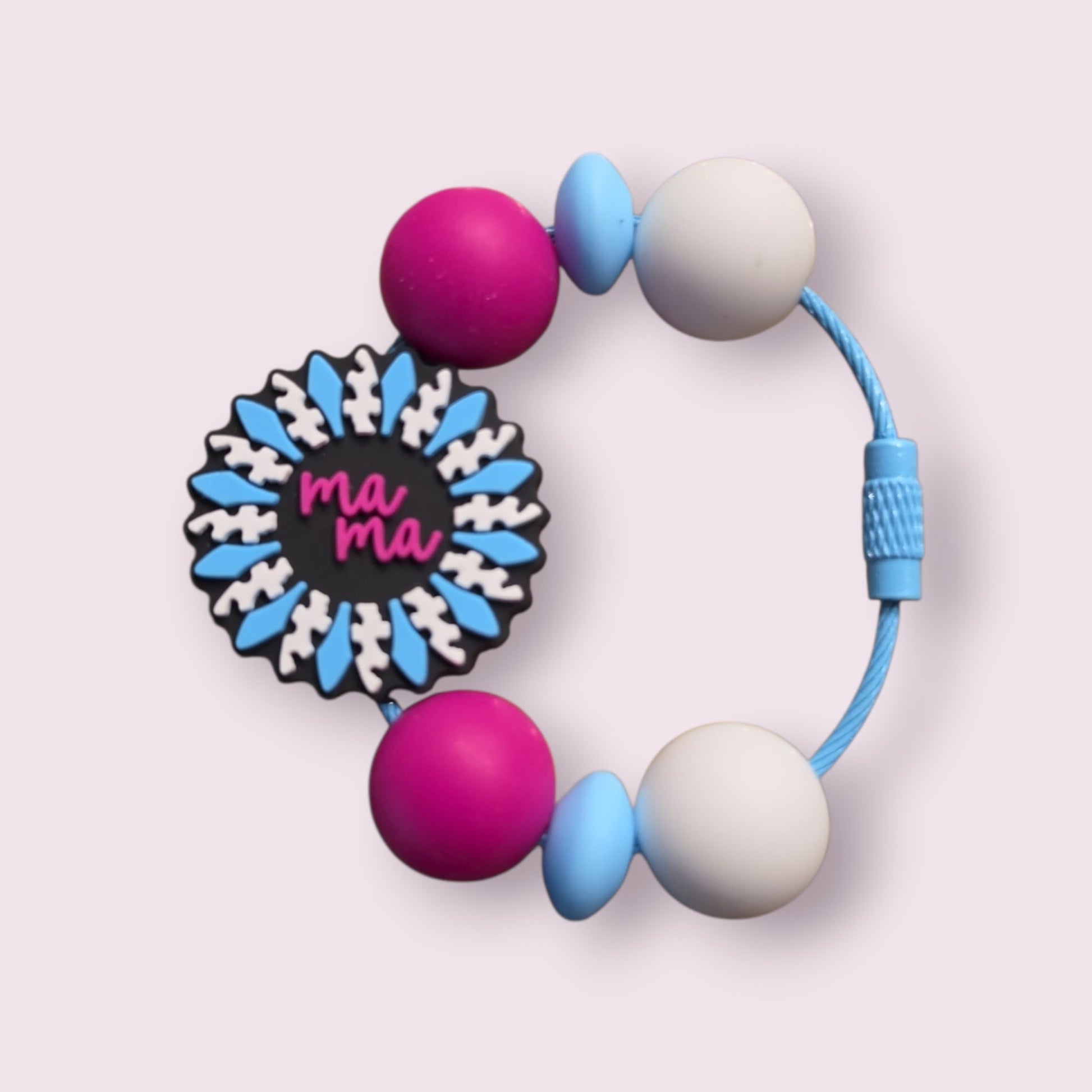 Colorful silicone teething bracelet with 'ma ma' charm, pink, blue, and white beads on cord